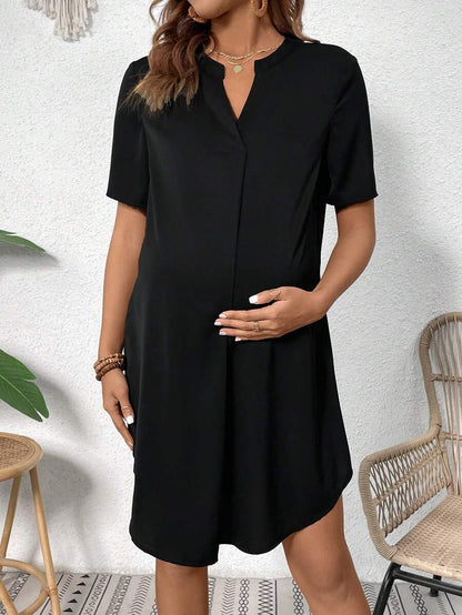 Maternity Notched Collar Short Sleeve Black Tunic Dress with Asymmetrical Slit Hem - Casual Loose Fit Woven Maternity Mini Dress