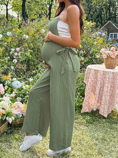 Black Solid Spaghetti Strap Maternity Jumpsuit – Loose Fit Side Knot Sleeveless Romper for Beach, Casual Everyday & Summer Travel