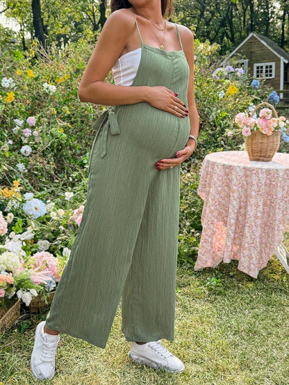Black Solid Spaghetti Strap Maternity Jumpsuit – Loose Fit Side Knot Sleeveless Romper for Beach, Casual Everyday & Summer Travel