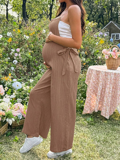 Black Solid Spaghetti Strap Maternity Jumpsuit – Loose Fit Side Knot Sleeveless Romper for Beach, Casual Everyday & Summer Travel