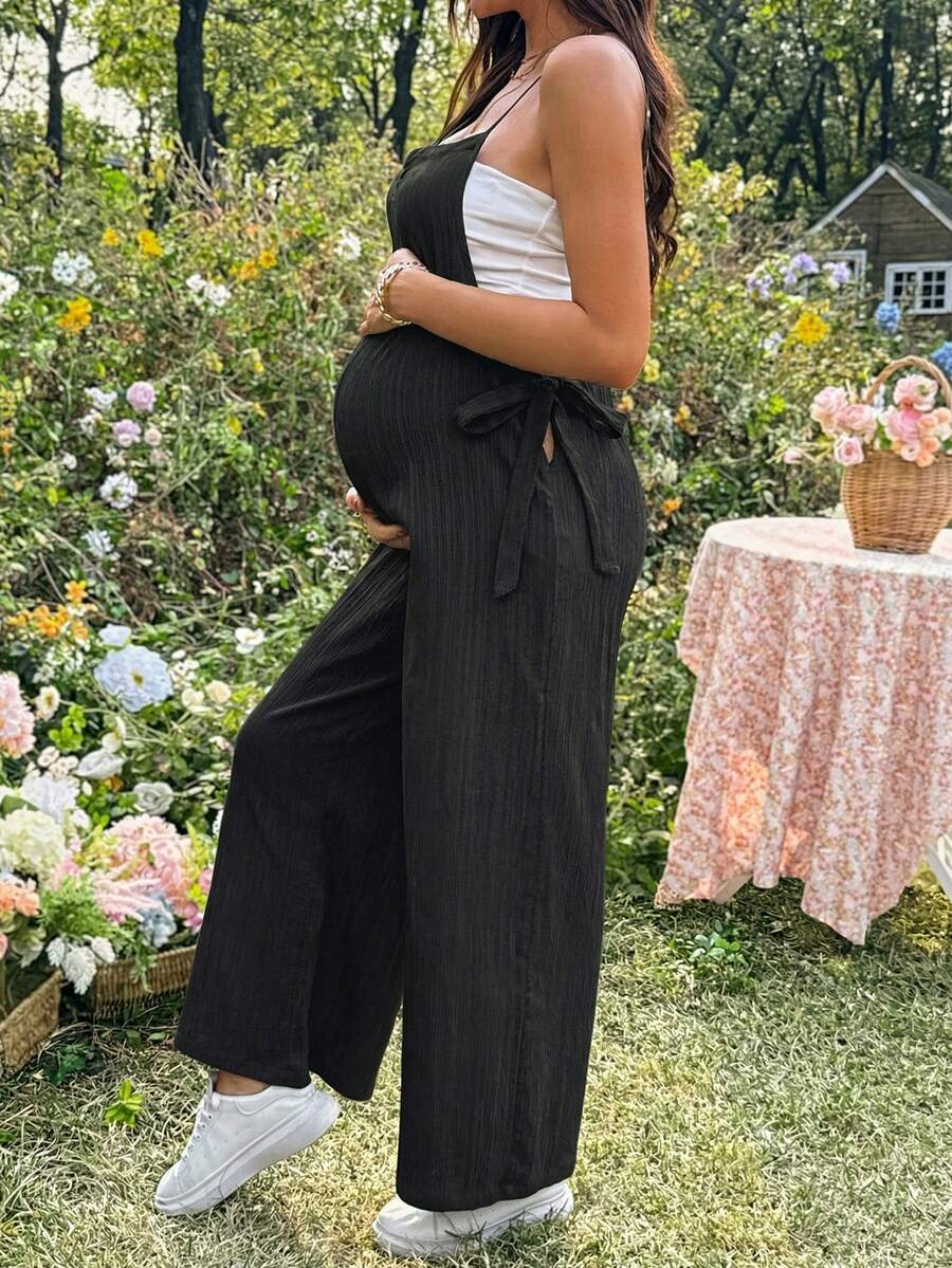 Black Solid Spaghetti Strap Maternity Jumpsuit – Loose Fit Side Knot Sleeveless Romper for Beach, Casual Everyday & Summer Travel