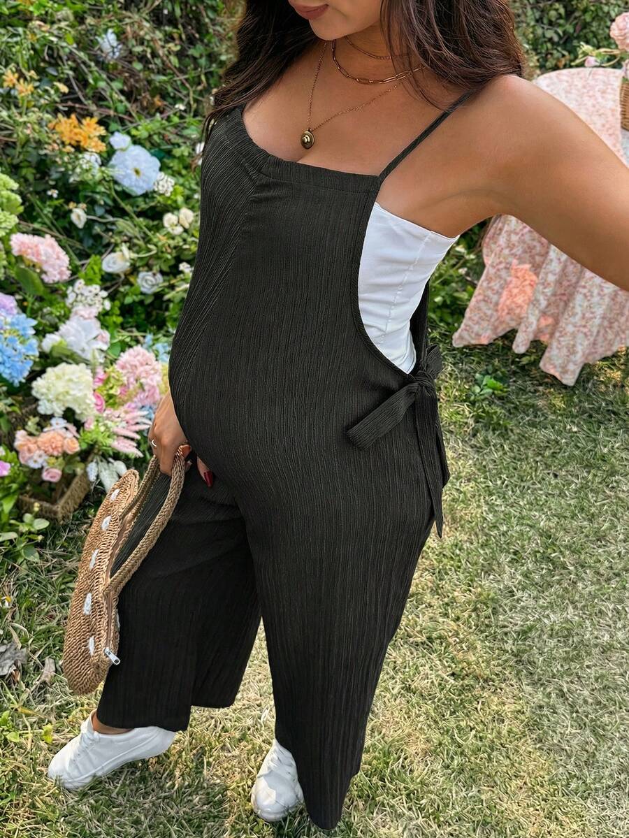 Black Solid Spaghetti Strap Maternity Jumpsuit – Loose Fit Side Knot Sleeveless Romper for Beach, Casual Everyday & Summer Travel
