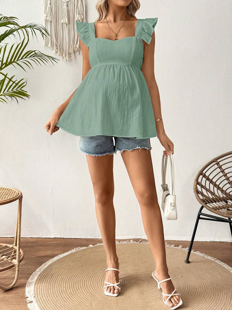 White Sleeveless Peplum Maternity Blouse Slim Fit Flounce Strap Neckline Flared Hem Long Length Woven Polyester Top