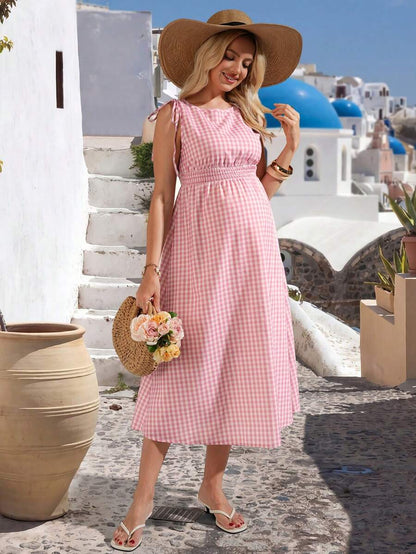 Pink and White Plaid Sleeveless A-Line Midi Maternity Dress - High Waist Round Neck Picnic Dress with Knot Detail and Flared Ruffle Hem