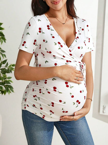 Cherry Print Short Sleeve Maternity and Nursing Top with V-Neck Wrap Tie Detail Slim Fit High Stretch Knitted Prenatal Shirt in Red and White