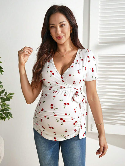 Cherry Print Short Sleeve Maternity and Nursing Top with V-Neck Wrap Tie Detail Slim Fit High Stretch Knitted Prenatal Shirt in Red and White