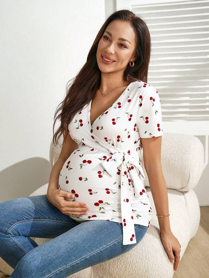 Cherry Print Short Sleeve Maternity and Nursing Top with V-Neck Wrap Tie Detail Slim Fit High Stretch Knitted Prenatal Shirt in Red and White